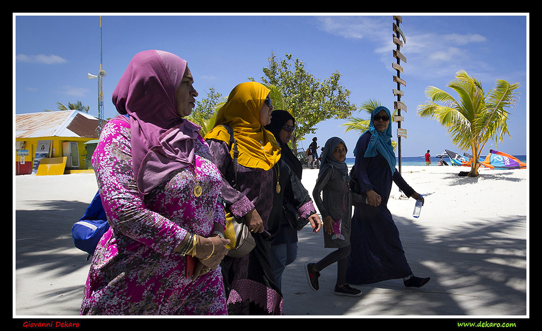 Women walking in Maafushi, Maldives